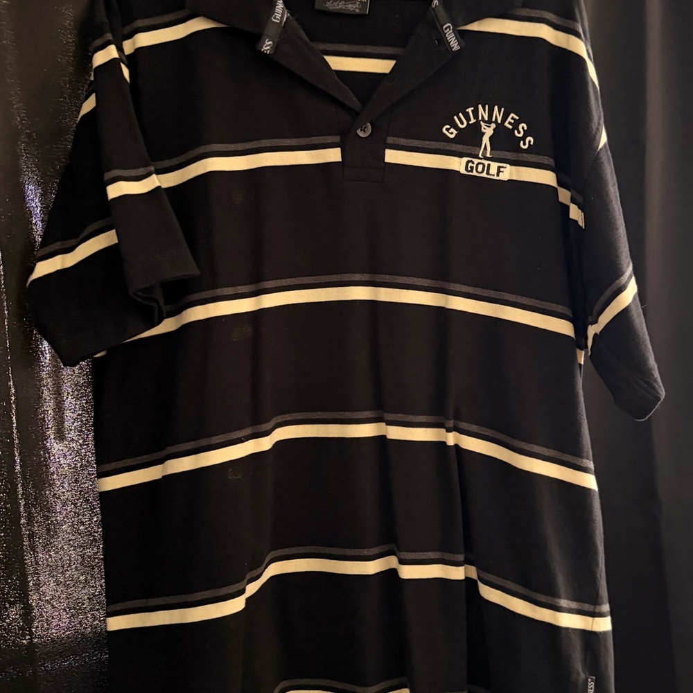 Guinness Men’s Black Polo with Cream Stripes and Golf Logo